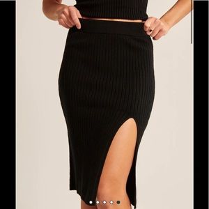 Black ribbed A&F midi length sweater skirt with slit.